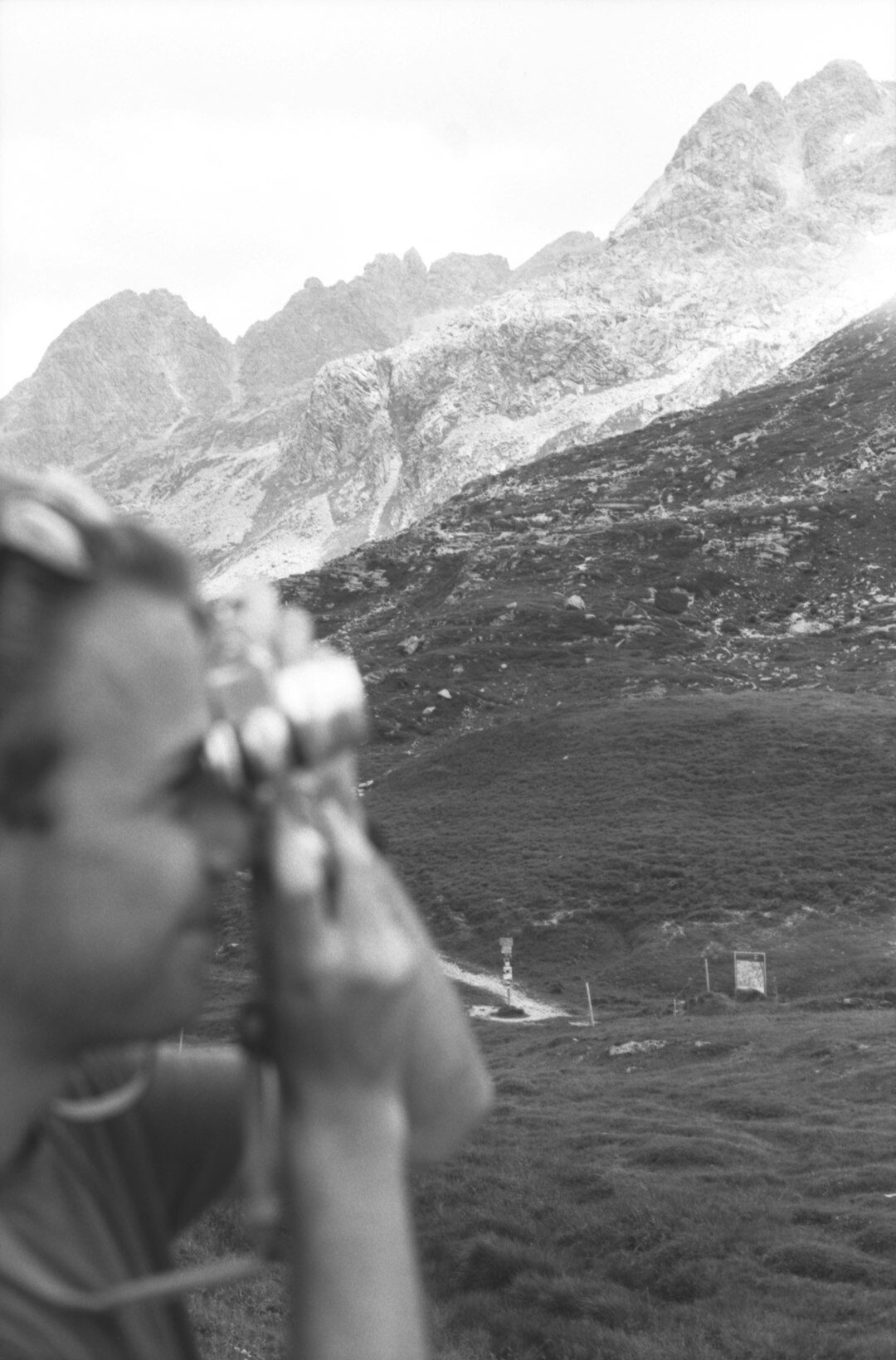 Colourist adjusting scopes and colour wheels while grading a mountain landscape shot